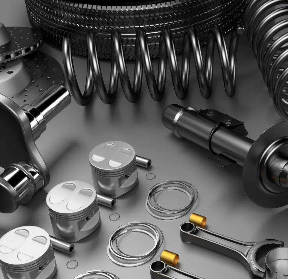 An image of various shiny metallic car parts, including pistons, connecting rods, a brake rotor, a crankshaft component, and large coil springs.