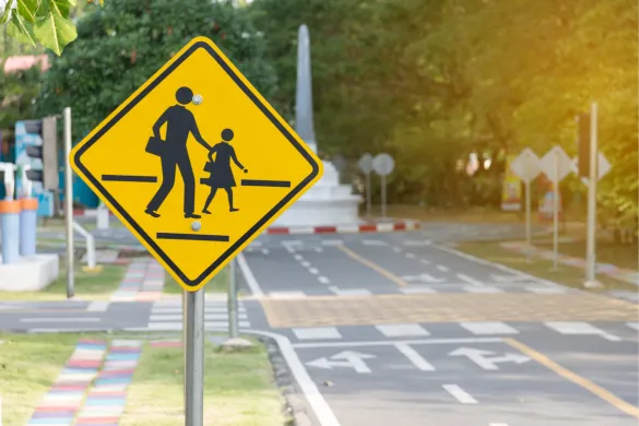 An image of a pedestrian crossing sign that shows two people walking